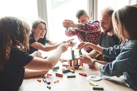 group-creative-friends-sitting-wooden-table-people-were-having-fun-while-playing-board-game-1-(1)(1) | flers agglo
