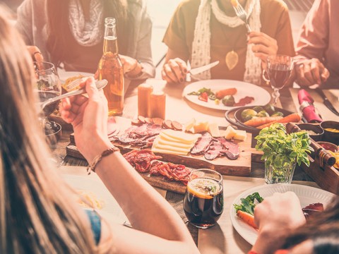 Group of people having meal togetherness dining | Adobe Stock